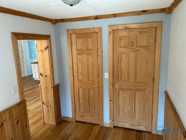 203 S Main, Hicksville, OH 43526 - doorway to outside with wood finished floors and crown molding