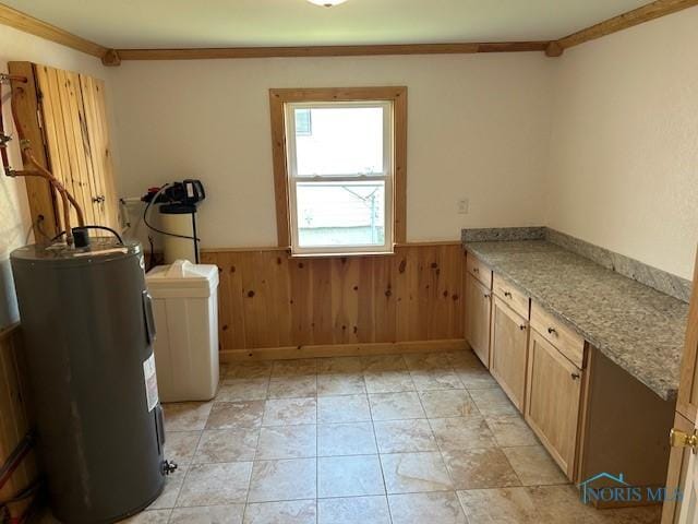 203 S Main, Hicksville, OH 43526 - washroom with a wainscoted wall, water heater, crown molding, wood walls, and cabinet space
