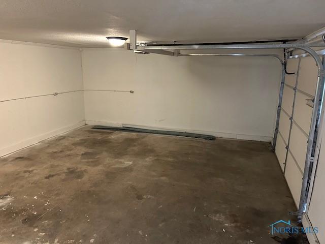 203 S Main, Hicksville, OH 43526 - garage featuring baseboards