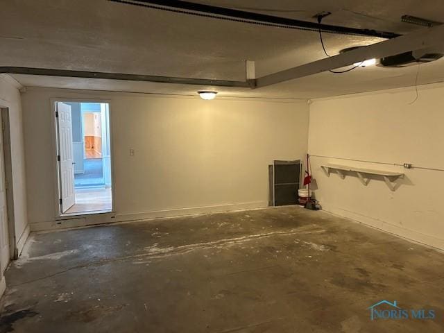 203 S Main, Hicksville, OH 43526 - garage featuring baseboards