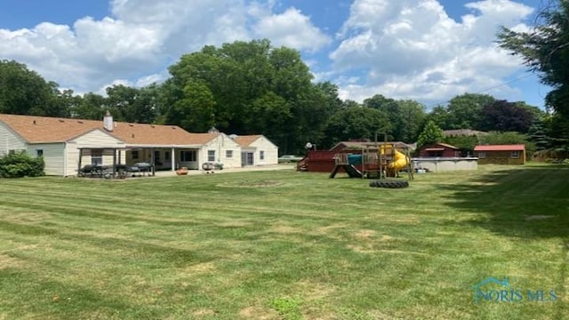 1036 Saint Andrews Rd, Toledo, OH 43607 - view of grassy yard with a patio