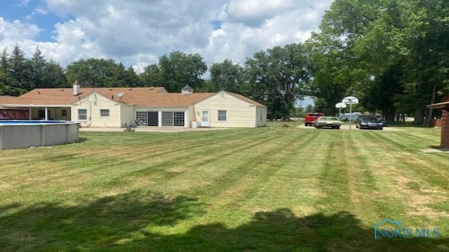 1036 Saint Andrews Rd, Toledo, OH 43607 - view of green lawn featuring an outdoor pool
