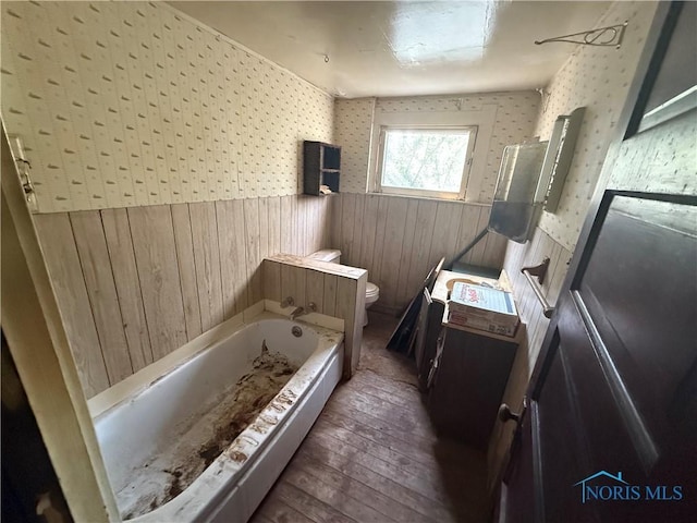 1441 Maumee St, Holland, OH 43528 - full bathroom with wainscoting, hardwood / wood-style flooring, wallpapered walls, a bathtub, and vanity