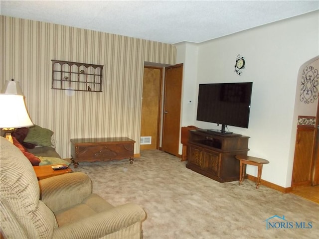 431 Fillmore St, Napoleon, OH 43545 - living area with carpet floors and wallpapered walls