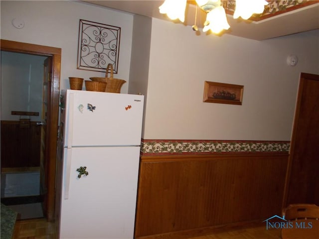431 Fillmore St, Napoleon, OH 43545 - kitchen featuring freestanding refrigerator and a chandelier