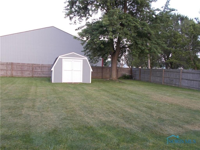 431 Fillmore St, Napoleon, OH 43545 - fenced backyard featuring a storage unit