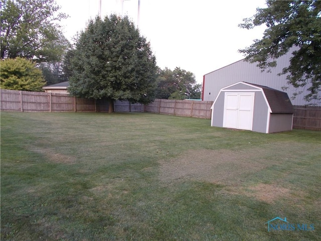431 Fillmore St, Napoleon, OH 43545 - fenced backyard featuring a storage shed