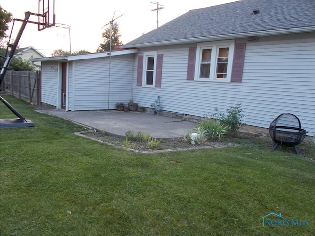 431 Fillmore St, Napoleon, OH 43545 - back of property featuring a shingled roof and a patio area