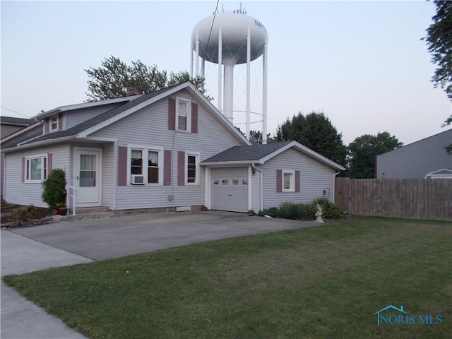 431 Fillmore St, Napoleon, OH 43545 - view of front of home featuring a garage, concrete driveway, a chimney, and roof with shingles