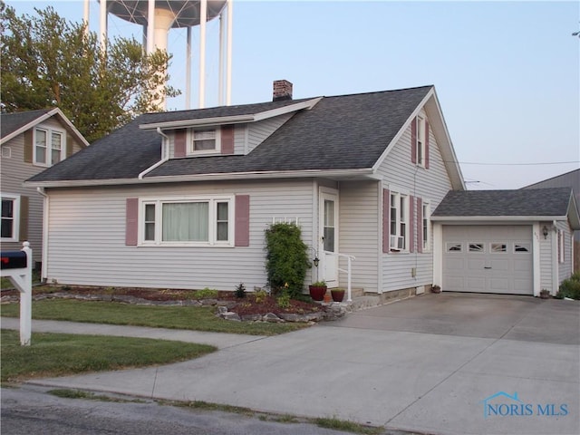 431 Fillmore St, Napoleon, OH 43545 - view of front of home featuring a chimney, concrete driveway, a garage, and a shingled roof