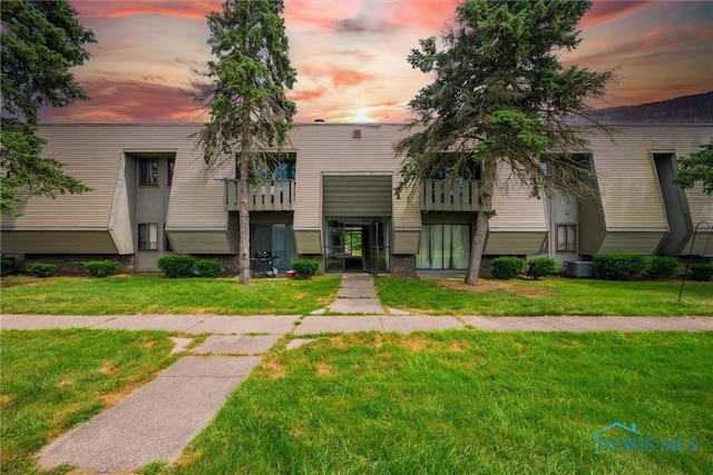 6201 Garden Rd Unit A14, Maumee, OH 43537 - view of property at dusk