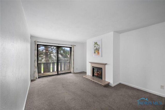 6201 Garden Rd Unit A14, Maumee, OH 43537 - unfurnished living room featuring carpet flooring and a glass covered fireplace