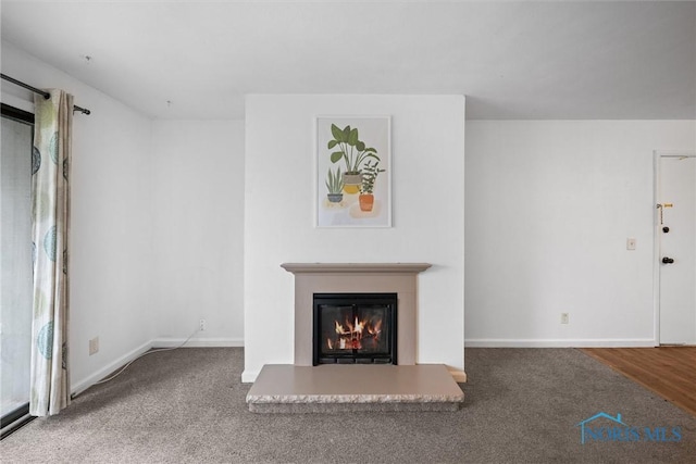 6201 Garden Rd Unit A14, Maumee, OH 43537 - unfurnished living room with a glass covered fireplace and carpet
