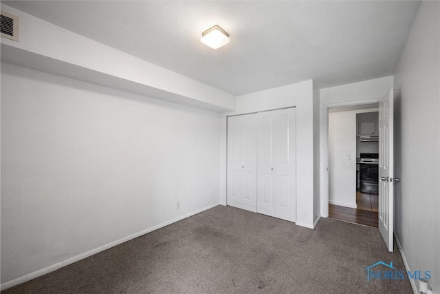6201 Garden Rd Unit A14, Maumee, OH 43537 - unfurnished bedroom featuring dark colored carpet and a closet