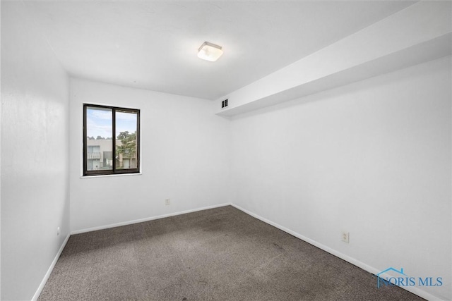 6201 Garden Rd Unit A14, Maumee, OH 43537 - spare room with carpet floors and baseboards