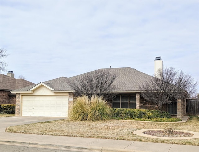 ranch-style house featuring a garage