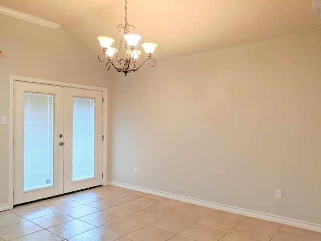 interior space with light tile patterned flooring, vaulted ceiling, a chandelier, and french doors