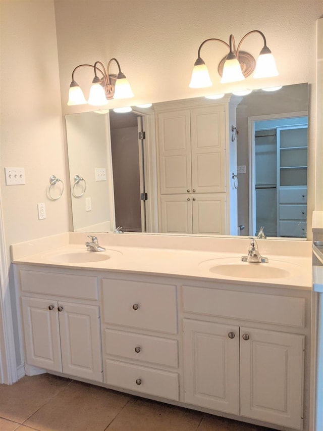 bathroom featuring tile patterned flooring and vanity