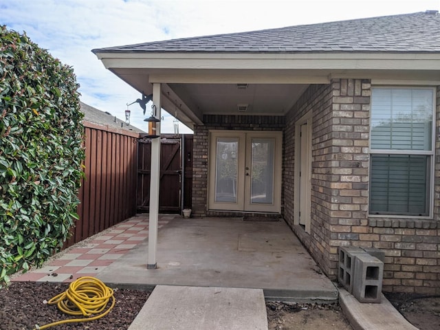 property entrance with a patio area and french doors