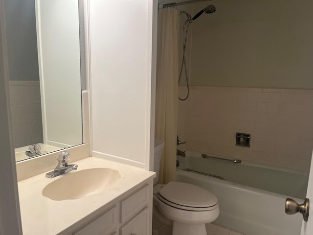 full bathroom featuring vanity, shower / bath combo, and toilet