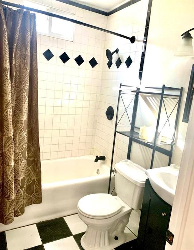 full bathroom with vanity, shower / tub combo, and toilet