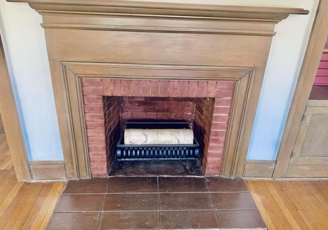 room details featuring a brick fireplace