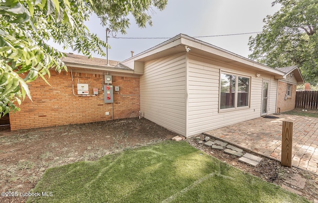 3423 60th St, Lubbock, TX 79413 - view of property exterior featuring a patio and brick siding