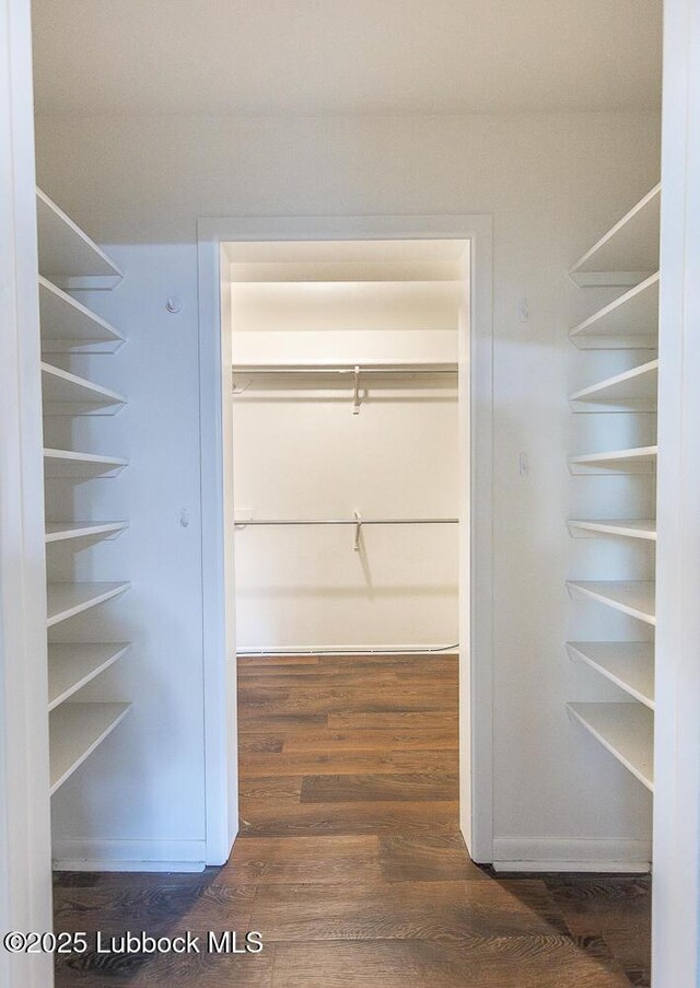 3423 60th St, Lubbock, TX 79413 - walk in closet with dark wood finished floors