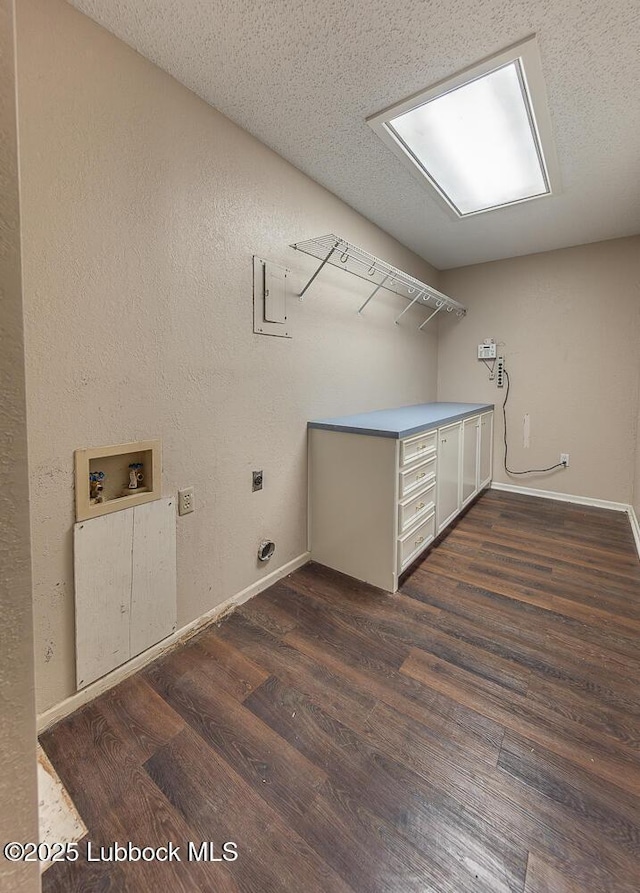 3423 60th St, Lubbock, TX 79413 - laundry room featuring electric dryer hookup, washer hookup, and dark wood-type flooring