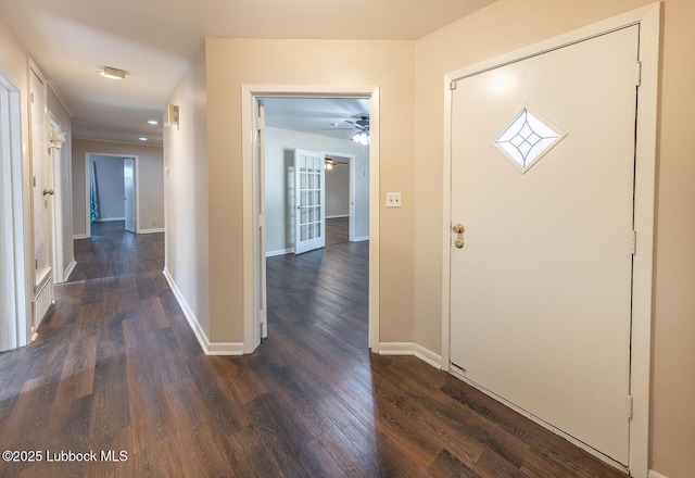 3423 60th St, Lubbock, TX 79413 - foyer entrance with a ceiling fan and dark wood finished floors