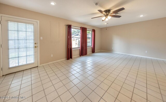 3423 60th St, Lubbock, TX 79413 - spare room with a ceiling fan, light tile patterned flooring, and recessed lighting