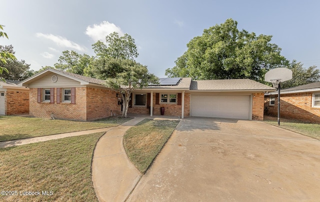 3423 60th St, Lubbock, TX 79413 - ranch-style house with brick siding, an attached garage, and a front yard