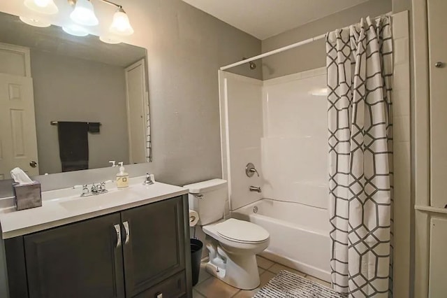 full bathroom featuring tile patterned flooring, vanity, shower / bath combination with curtain, and toilet