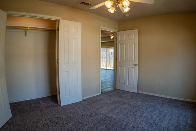 unfurnished bedroom with a closet, ceiling fan, and dark colored carpet