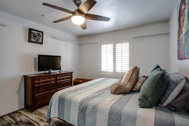 bedroom with light hardwood / wood-style floors and ceiling fan