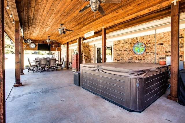 view of patio featuring a hot tub and ceiling fan