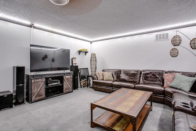 living room featuring light carpet and a textured ceiling