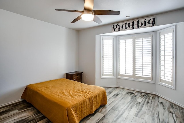 bedroom featuring ceiling fan and hardwood / wood-style floors