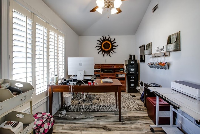 office space with hardwood / wood-style flooring, ceiling fan, and vaulted ceiling