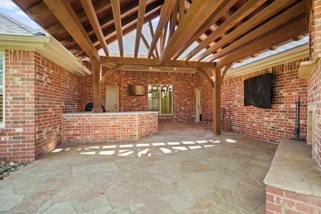 view of patio featuring a pergola and area for grilling