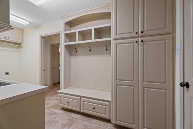 mudroom with light tile patterned flooring