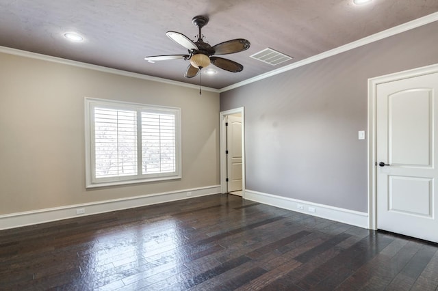 spare room with ornamental molding, dark wood-type flooring, and ceiling fan