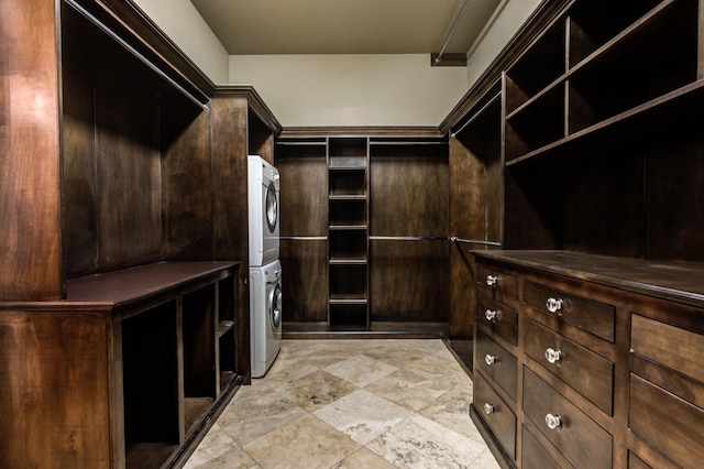 spacious closet with stacked washing maching and dryer