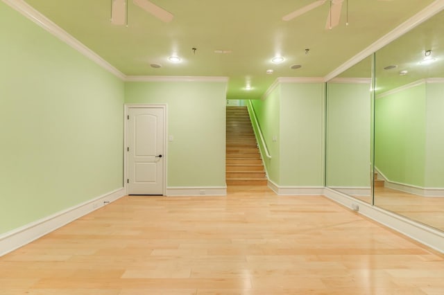 spare room featuring ceiling fan, ornamental molding, and light hardwood / wood-style flooring