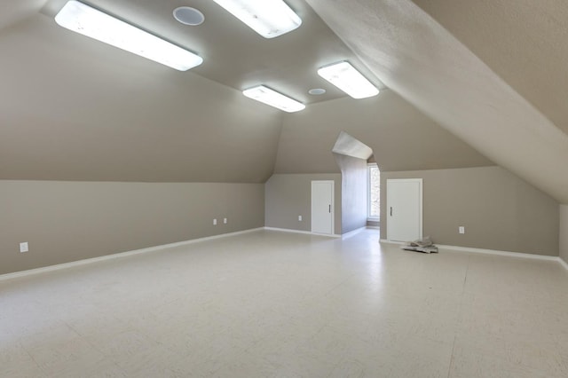 bonus room featuring lofted ceiling