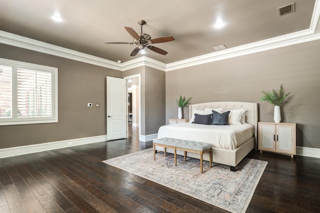 bedroom with crown molding, dark hardwood / wood-style floors, and ceiling fan