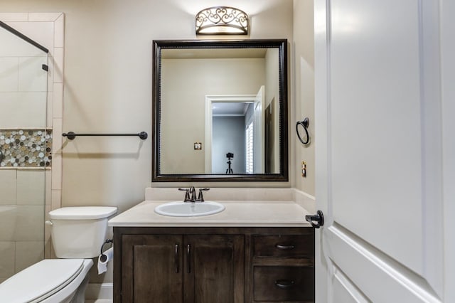 bathroom with vanity, toilet, and walk in shower