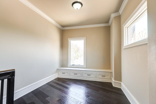 unfurnished room featuring dark hardwood / wood-style flooring and crown molding