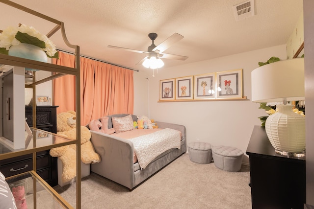 6109 Elkhart Ave, Lubbock, TX 79424 - carpeted bedroom with a textured ceiling and ceiling fan