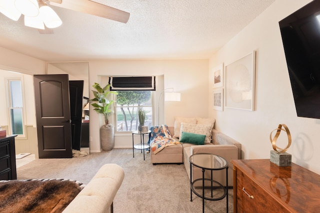 6109 Elkhart Ave, Lubbock, TX 79424 - carpeted living room featuring a textured ceiling and a ceiling fan